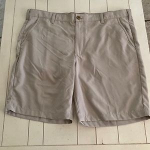 Izod mens golf shorts in size 40. 100% polyester.Tan in color.